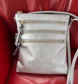 Silver crossbody handbag with contrasting gold zips & hardware  In excellent condition. Purchased in Toulouse