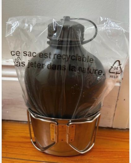 Genuine army-style metal water bottle with matching nesting cup. Military surplus