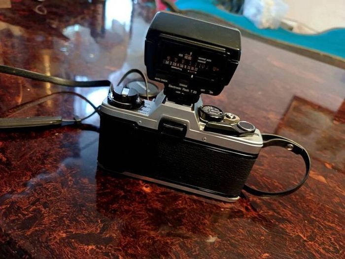 Olympus OM 10 camera with flash