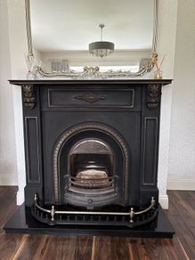 Cast iron fireplace , silver surround & fire guard