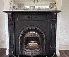 Cast iron fireplace , silver surround & fire guard