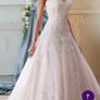 Wedding dress. Size 12. Brand new. Stunning dress! Heavily beaded. Fabulous pink underlay. Image 3