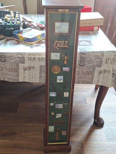 Beautiful Wooden Golf-Themed Shadow Box and Storage Unit with Shelves Cabinet, featuring a glass door front Inside the glass display panel, it showcases a vintage-style collage celebrating the history of golf,