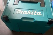 The Makita GA004G 115mm 40V XGT grinder with battery and charger