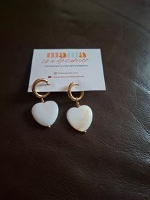 Gold hoop earrings with shell heart