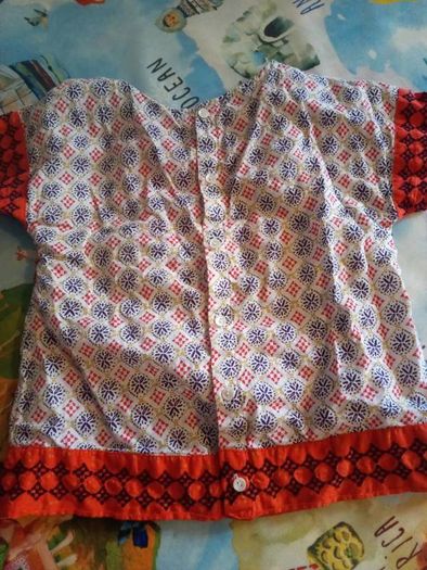 DP...am beautiful orange top with pretty details