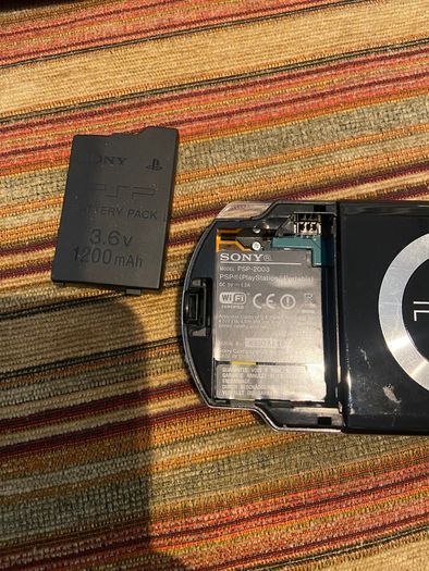 PSP  Console plus 10 games, charger and headphones