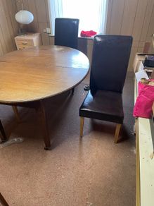 Table and three leather chairs