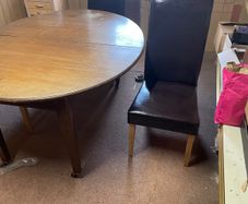 Table and three leather chairs