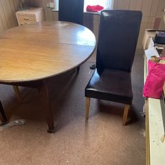 Table and three leather chairs