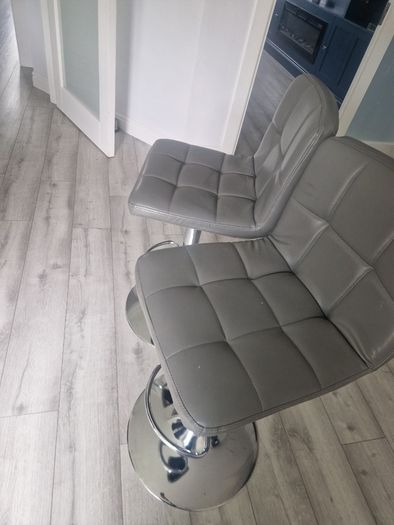 2 grey leather look swivel bar stools