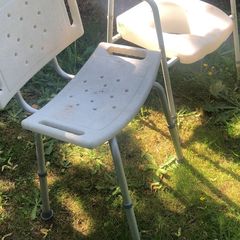 Shower seat and raised toilet seat as seen