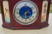 Antique Chinese table clock in a wooden case
