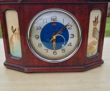 Antique Chinese table clock in a wooden case