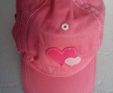 New pink sun cap tag attached