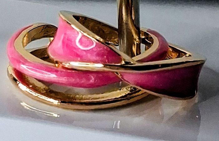 A Pair of Pink Oil Drip Rings with Open Ring & Twist Ribbon Ring