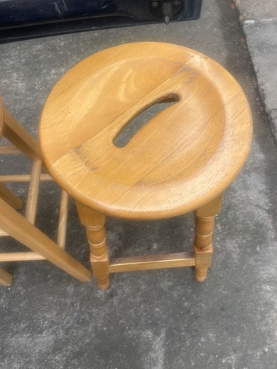 2 solid wood bar stools.