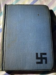 book the refugees: a tale of two continents with the dextrogyre swastika on it