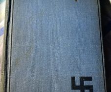 book the refugees: a tale of two continents with the dextrogyre swastika on it