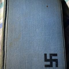 book the refugees: a tale of two continents with the dextrogyre swastika on it