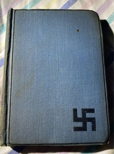 book the refugees: a tale of two continents with the dextrogyre swastika on it