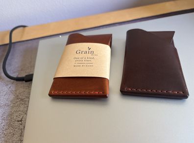 Two Taurus Camp Mini Wallets, one used, one unused