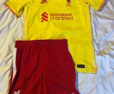 Liverpool boys jersey and shorts