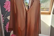 Blush coloured blouse.
