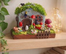 handcrafted fairy cottage with moss roof!