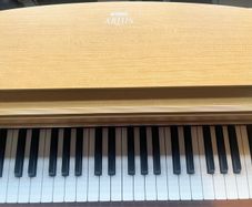 YAMAHA AURIS PIANO with adjustable piano stool