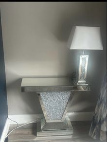 console table with lamp and clock