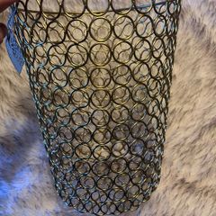 Two gold metal bins