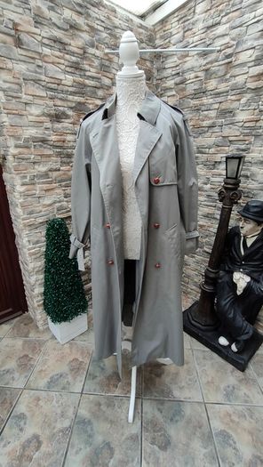 Vintage Nuage ladies trenchcoat Approximately late 90s early 00s Size 10 on label The colour is a pale bluey grey with brown buttons It's got an inner lining that can be removed