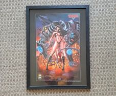 Vampirella and Cyberfrog Framed Print