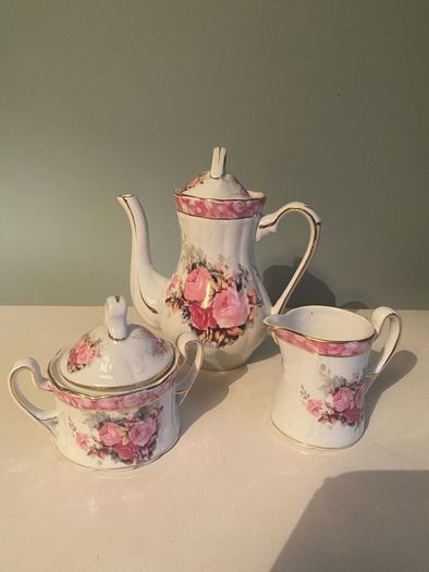 Vintage Porcelain small teapot sugar bowl and creamer set .       porcelain