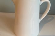 Large six inch tall jug or water pitcher