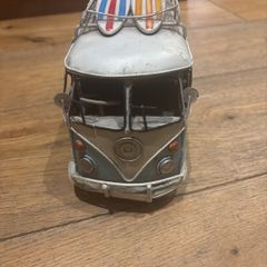 vintage Volkswagen caravan Elle with surfboard on top