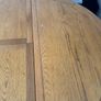 Oak round extending dining table with bench & chair Image 3