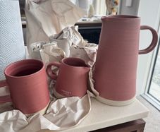 Jug, pitcher and four matching ceramic mugs