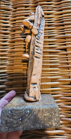 A terracotta sculpture of a hill walker by Irish artist Ronnie Fulton.