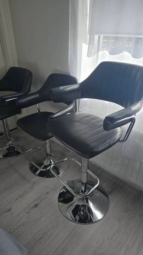 Adjustable black faux leather swivel bar stool with a metal base x3