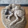 Sculpture of a boy sleeping with a dog Image 2