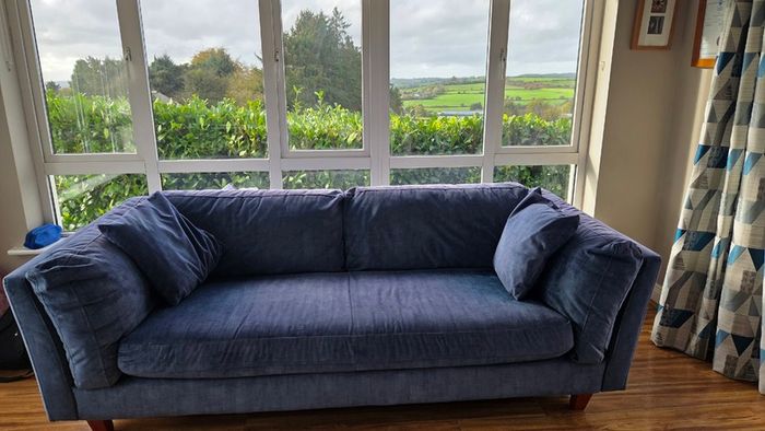 Blue fabric three-seater sofa