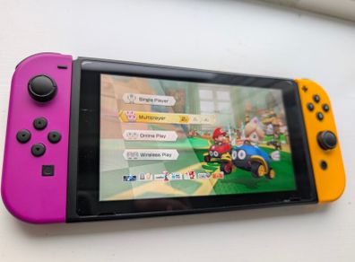 Nintendo Switch + Travel accessories + SD card + Diablo III