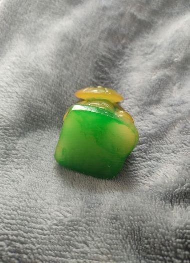 two inch high green Buddha