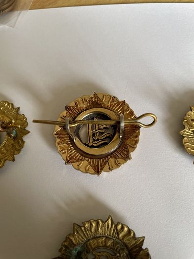 Irish Army cap badges three brass one staybrite