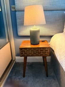 Two bedside lockers and lamps