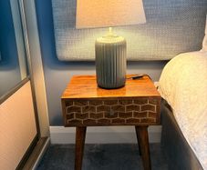 Two bedside lockers and lamps