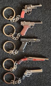 Keyring, firearms, luger. Nagant, glock, colt.