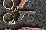 Keyring, firearms, luger. Nagant, glock, colt.